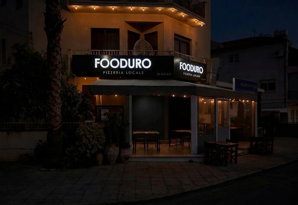 FOODURO pizzeria interior — warm wood, low lights, open kitchen ambiance